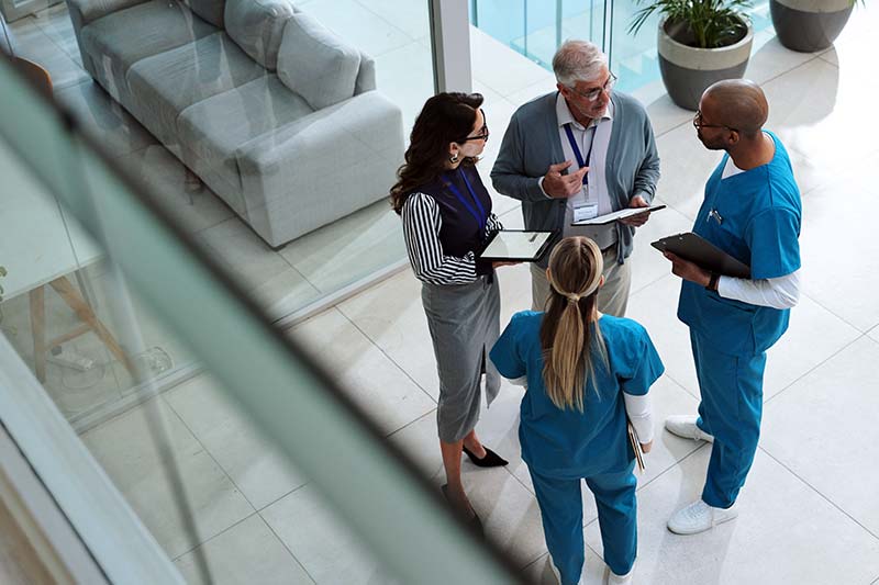 healthcare team of four discussing relevant issues