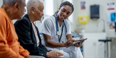 provider discussing healthcare imaging results with an elderly couple